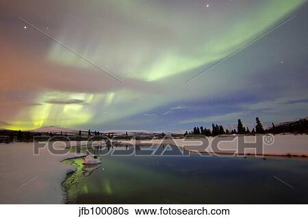 Aurora borealis over creek by Fish Lake, Whitehorse, Yukon, Canada. View Large Photo Image Stock Photograph - Aurora borealis over creek by Fish Lake, Whitehorse, Yukon, Canada.. Fotosearch