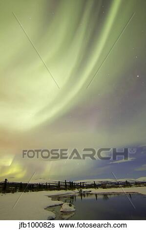 Aurora borealis over creek by Fish Lake, Whitehorse, Yukon, Canada. View Large Photo Image Stock Photograph - Aurora borealis over creek by Fish Lake, Whitehorse, Yukon, Canada.. Fotosearch
