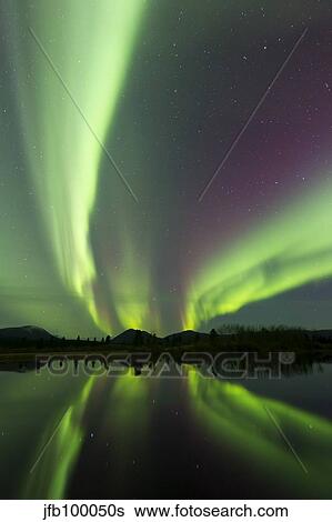 Aurora borealis over Fish lake, Whitehorse, Yukon, Canada. View Large Photo Image Stock Photograph - Aurora borealis over Fish lake, Whitehorse, Yukon, Canada.. Fotosearch