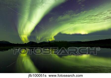 Aurora borealis over Fish lake, Whitehorse, Yukon, Canada. View Large Photo Image Stock Photograph - Aurora borealis over Fish lake, Whitehorse, Yukon, Canada.. Fotosearch