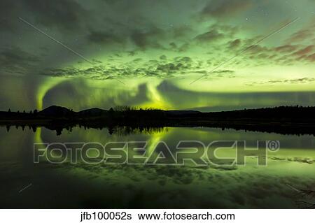 Stock Photograph - Aurora borealis over Fish lake, Whitehorse, Yukon, Canada.. Fotosearch