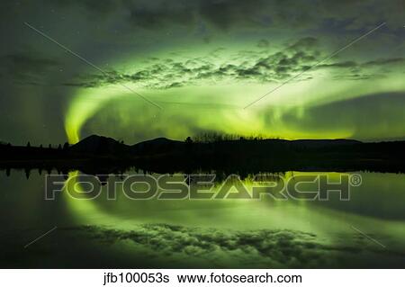 Aurora borealis over Fish lake, Whitehorse, Yukon, Canada. View Large Photo Image Stock Photograph - Aurora borealis over Fish lake, Whitehorse, Yukon, Canada.. Fotosearch