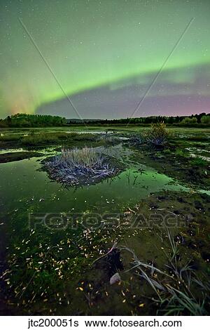 Aurora borealis over Fish Lake, Whitehorse, Yukon, Canada. View Large Photo Image Stock Photograph - Aurora borealis over Fish Lake, Whitehorse, Yukon, Canada.. Fotosearch