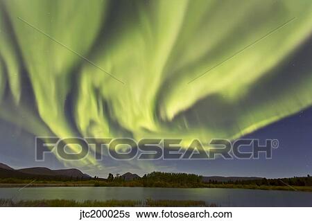 Aurora borealis over Fish Lake, Yukon, Canada. View Large Photo Image Stock Photograph - Aurora borealis over Fish Lake, Yukon, Canada.. Fotosearch