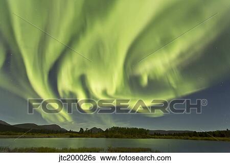 Aurora borealis over Fish Lake, Yukon, Canada. View Large Photo Image Stock Photograph - Aurora borealis over Fish Lake, Yukon, Canada.. Fotosearch