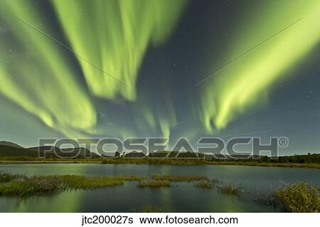 Aurora borealis over Fish Lake, Yukon, Canada. View Large Photo Image Stock Photograph - Aurora borealis over Fish Lake, Yukon, Canada.. Fotosearch