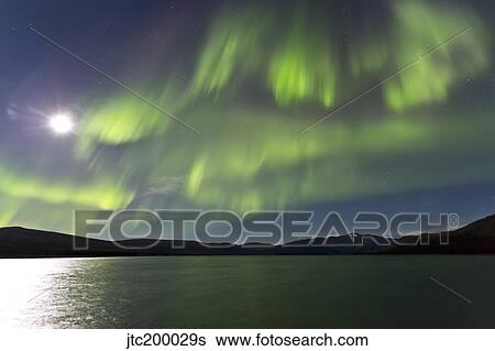 Aurora borealis over Fish Lake, Yukon, Canada. View Large Photo Image Stock Photograph - Aurora borealis over Fish Lake, Yukon, Canada.. Fotosearch