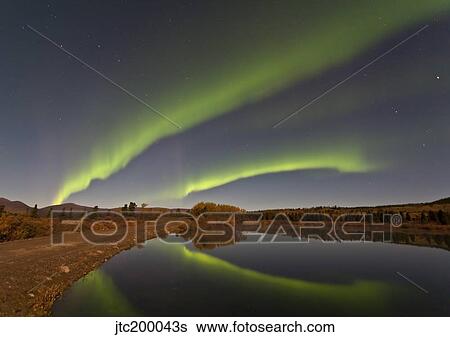 Aurora borealis over Fish Lake, Yukon, Canada. View Large Photo Image Stock Photograph - Aurora borealis over Fish Lake, Yukon, Canada.. Fotosearch