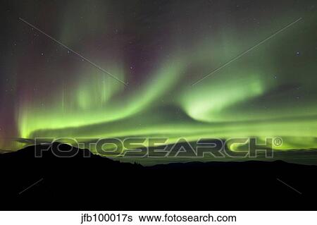 Aurora borealis over Gray Peak, Whitehorse, Yukon Canada. View Large Photo Image Stock Photograph - Aurora borealis over Gray Peak, Whitehorse, Yukon Canada.. Fotosearch