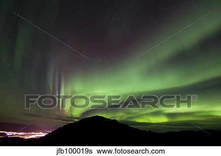Aurora borealis over Gray Peak, Whitehorse, Yukon Canada. View Large Photo Image Stock Photograph - Aurora borealis over Gray Peak, Whitehorse, Yukon Canada.. Fotosearch