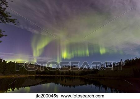 Aurora borealis over Hidden Lake, Yukon, Canada. View Large Photo Image Stock Photograph - Aurora borealis over Hidden Lake, Yukon, Canada.. Fotosearch