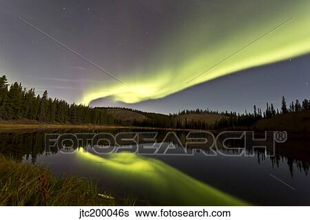 Aurora borealis over Hidden Lake, Yukon, Canada. View Large Photo Image Stock Photograph - Aurora borealis over Hidden Lake, Yukon, Canada.. Fotosearch