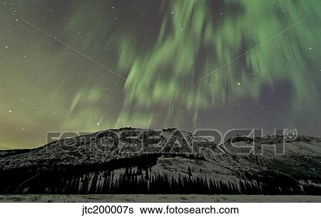 Aurora borealis over mountain, Annie Lake, Yukon, Canada. View Large Photo Image Stock Photograph - Aurora borealis over mountain, Annie Lake, Yukon, Canada.. Fotosearch