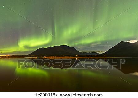Aurora borealis over mountain, Carcross, Yukon, Canada. View Large Photo Image Stock Photograph - Aurora borealis over mountain, Carcross, Yukon, Canada.. Fotosearch