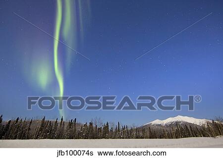 Aurora borealis over mountain with moonlight near Mayo, Yukon, Canada. View Large Photo Image Stock Photograph - Aurora borealis over mountain with moonlight near Mayo, Yukon, Canada.. Fotosearch