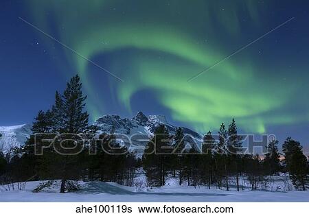 Stock Photograph - Aurora Borealis over Nova Mountain Wilderness, Troms, Norway.. Fotosearch