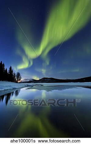 Aurora Borealis over Sandvannet Lake in Troms County, Norway. View Large Photo Image Stock Photograph - Aurora Borealis over Sandvannet Lake in Troms County, Norway.. Fotosearch