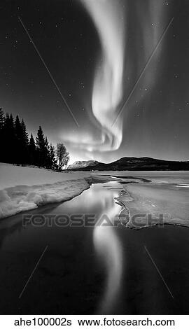 Aurora Borealis over Sandvannet Lake in Troms County, Norway. View Large Photo Image Stock Photograph - Aurora Borealis over Sandvannet Lake in Troms County, Norway.. Fotosearch