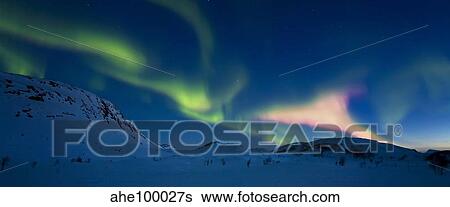 Stock Photograph - Aurora Borealis over Skittendalen Valley, Troms County, Norway.. Fotosearch