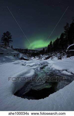 Aurora Borealis over Tennevik River in Norway. View Large Photo Image Stock Photograph - Aurora Borealis over Tennevik River in Norway.. Fotosearch