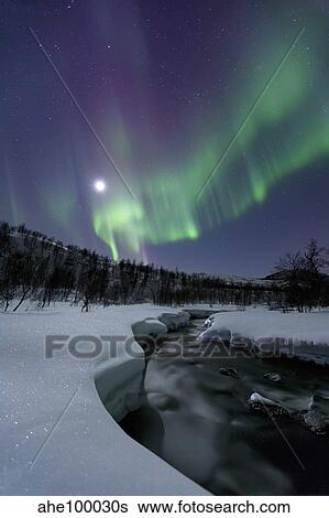 Aurora Borealis over the Blafjellelva River in Troms County, Norway. View Large Photo Image Stock Photograph - Aurora Borealis over the Blafjellelva River in Troms County, Norway.. Fotosearch