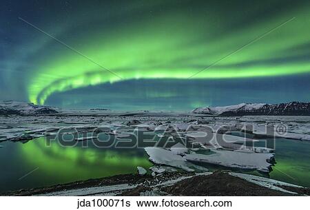 Aurora borealis over the glacial lagoon Jokulsarlon in Iceland. View Large Photo Image Stock Photograph - Aurora borealis over the glacial lagoon Jokulsarlon in Iceland.. Fotosearch