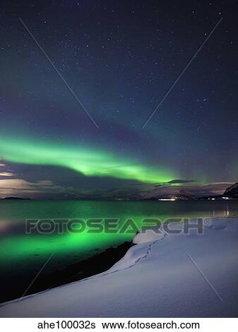 Aurora Borealis over Vagsfjorden in Troms County, Norway. View Large Photo Image Stock Photograph - Aurora Borealis over Vagsfjorden in Troms County, Norway.. Fotosearch