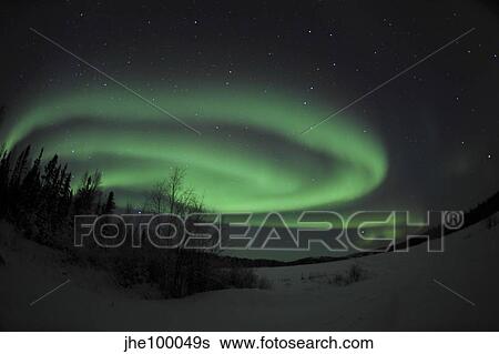 Stock Photograph - Aurora Borealis over Vee Lake, Northwest Territories, Canada.. Fotosearch