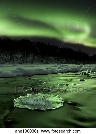 Aurora Borealis reflects off the Tennevik River, Troms County, Norway. View Large Photo Image Stock Photograph - Aurora Borealis reflects off the Tennevik River, Troms County, Norway.. Fotosearch