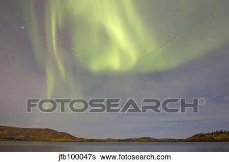 Aurora borealis with big dipper and moonlight over Lake Laberge, Yukon, Canada. View Large Photo Image Stock Photograph - Aurora borealis with big dipper and moonlight over Lake Laberge, Yukon, Canada.. Fotosearch