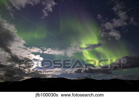 Aurora borealis with moonlight at Fish Lake, Yukon, Canada. View Large Photo Image Stock Photograph - Aurora borealis with moonlight at Fish Lake, Yukon, Canada.. Fotosearch