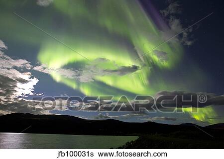 Aurora borealis with moonlight at Fish Lake, Yukon, Canada. View Large Photo Image Stock Photograph - Aurora borealis with moonlight at Fish Lake, Yukon, Canada.. Fotosearch