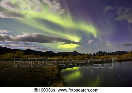 Aurora borealis with moonlight at Fish Lake, Yukon, Canada. View Large Photo Image Stock Photograph - Aurora borealis with moonlight at Fish Lake, Yukon, Canada.. Fotosearch