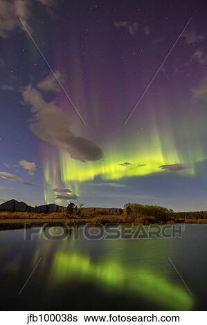 Aurora borealis with moonlight at Fish Lake, Yukon, Canada. View Large Photo Image Stock Photograph - Aurora borealis with moonlight at Fish Lake, Yukon, Canada.. Fotosearch