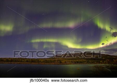 Aurora borealis with moonlight at Fish Lake, Yukon, Canada. View Large Photo Image Stock Photograph - Aurora borealis with moonlight at Fish Lake, Yukon, Canada.. Fotosearch
