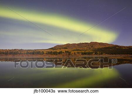 Aurora borealis with moonlight at Fish Lake, Yukon, Canada. View Large Photo Image Stock Photograph - Aurora borealis with moonlight at Fish Lake, Yukon, Canada.. Fotosearch