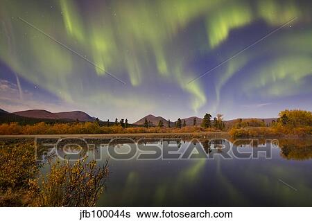 Aurora borealis with moonlight at Fish Lake, Yukon, Canada. View Large Photo Image Stock Photograph - Aurora borealis with moonlight at Fish Lake, Yukon, Canada.. Fotosearch