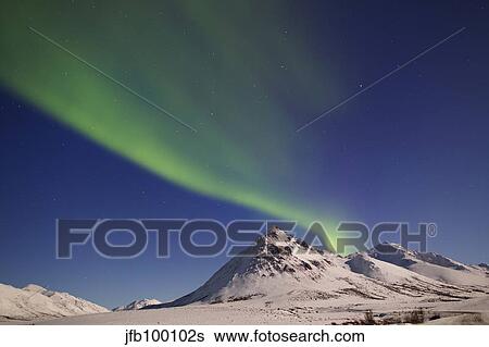 Aurora borealis with moonlight over Ogilvie Mountains, Canada. View Large Photo Image Stock Photograph - Aurora borealis with moonlight over Ogilvie Mountains, Canada.. Fotosearch