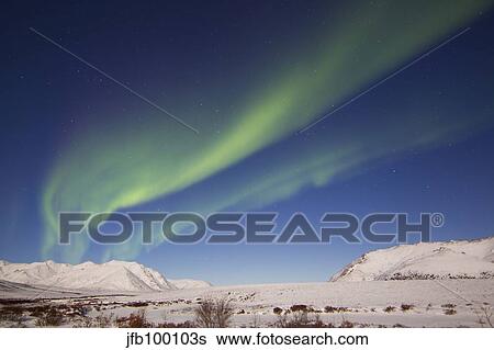Aurora borealis with moonlight over Ogilvie Mountains, Canada. View Large Photo Image Stock Photograph - Aurora borealis with moonlight over Ogilvie Mountains, Canada.. Fotosearch