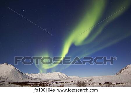 Aurora borealis with moonlight over Ogilvie Mountains, Canada. View Large Photo Image Stock Photograph - Aurora borealis with moonlight over Ogilvie Mountains, Canada.. Fotosearch