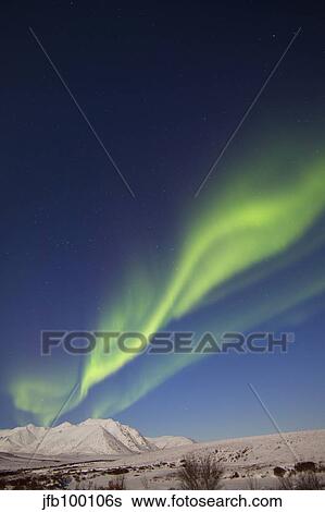 Aurora borealis with moonlight over Ogilvie Mountains, Canada. View Large Photo Image Stock Photograph - Aurora borealis with moonlight over Ogilvie Mountains, Canada.. Fotosearch