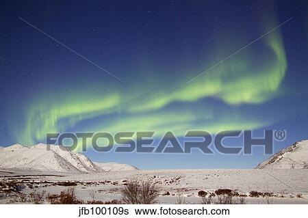 Aurora borealis with moonlight over Ogilvie Mountains, Canada. View Large Photo Image Stock Photograph - Aurora borealis with moonlight over Ogilvie Mountains, Canada.. Fotosearch