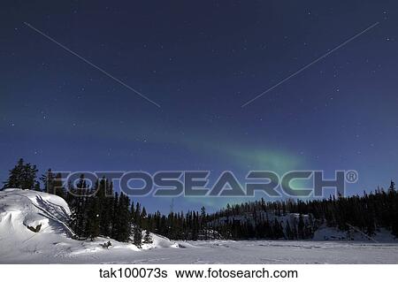 Stock Photograph - Aurora over Vee Lake, Yellowknife, Northwest Territories, Canada.. Fotosearch
