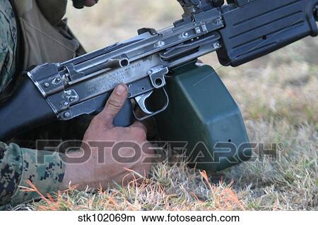 Automatic rifleman fixes a weapons jam. View Large Photo Image Picture - Automatic rifleman fixes a weapons jam.. Fotosearch