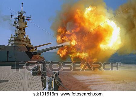 Battleship USS Wisconsin fires a round from one of the Mark 7 16-inch/50-caliber guns. View Large Photo Image Picture - Battleship USS Wisconsin fires a round from one of the Mark 7 16-inch/50-caliber guns.. Fotosearch