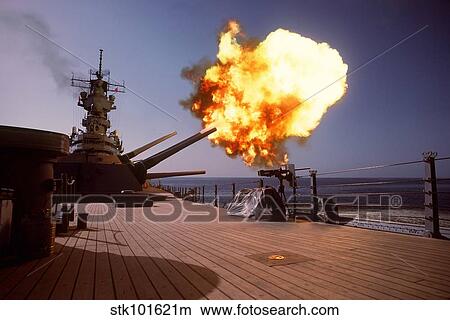 Battleship USS Wisconsin fires one of the Mark 7 16-inch/50-caliber guns. View Large Photo Image Picture - Battleship USS Wisconsin fires one of the Mark 7 16-inch/50-caliber guns.. Fotosearch