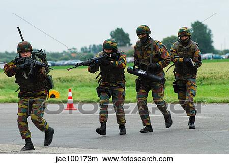 Belgian paracommandos entering the scene during an evacuation training session. View Large Photo Image Picture - Belgian paracommandos entering the scene during an evacuation training session.. Fotosearch