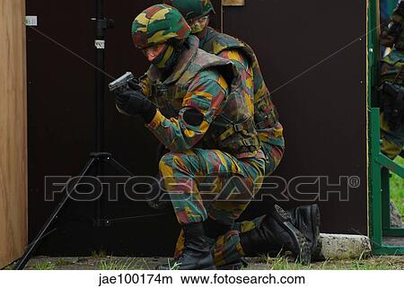 Belgian paracommandos entering the scene during an evacuation training session. View Large Photo Image Picture - Belgian paracommandos entering the scene during an evacuation training session.. Fotosearch