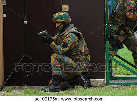 Belgian paracommandos entering the scene during an evacuation training session. View Large Photo Image Picture - Belgian paracommandos entering the scene during an evacuation training session.. Fotosearch