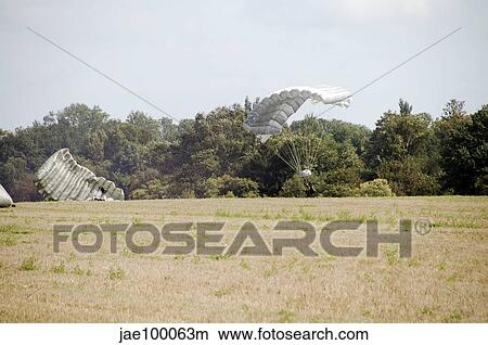 Belgian Paratroopers descending on the ground. View Large Photo Image Picture - Belgian Paratroopers descending on the ground.. Fotosearch